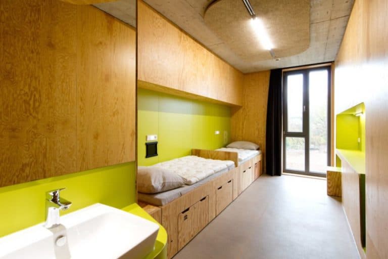 Laboratory for Visionary Architecture youth hostel, youth hostel Bayreuth, Y-shaped architecture, modular wooden wall system, modular custom built-in furniture, contemporary youth hostel, LAVA youth hostel, Bayreuth youth hostel by LAVA, sports youth hostel in Germany